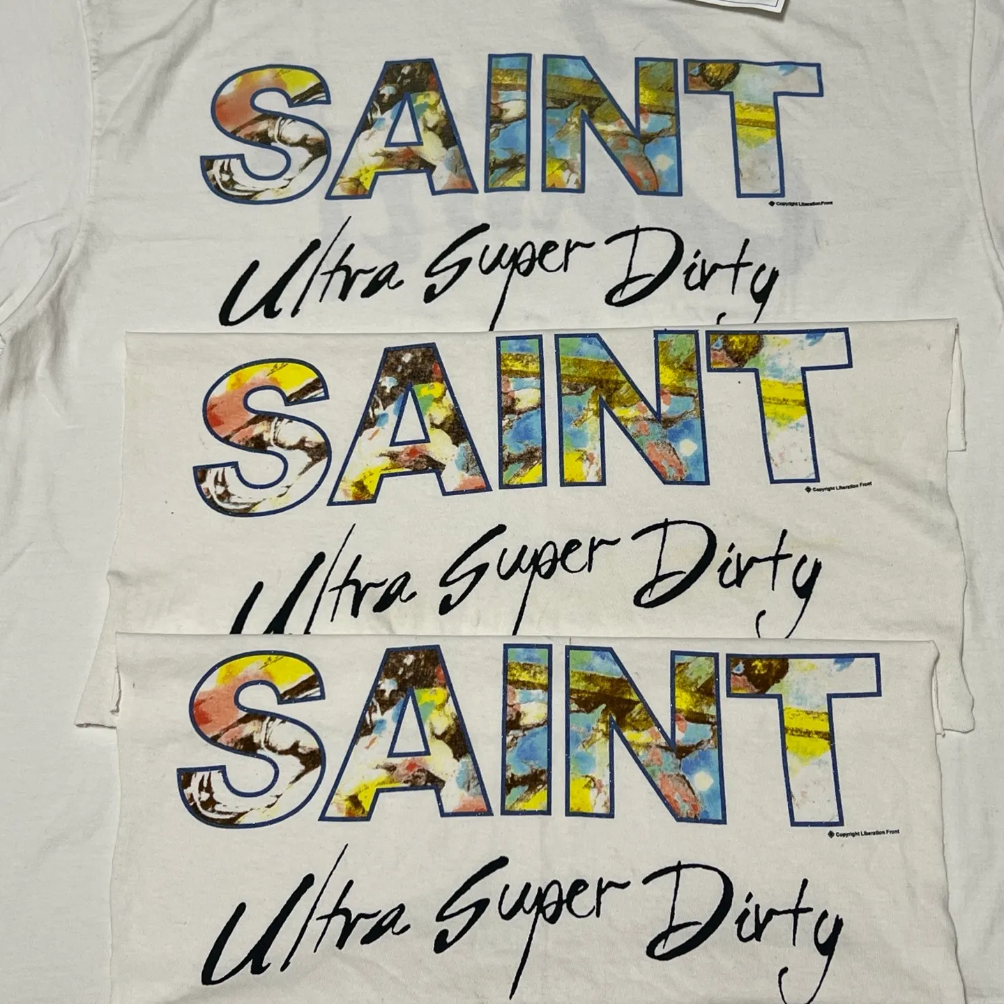 SAINT Mxxxxxx SS TEE/SUPER DIRTY/WHT oil painting SAINT SUPER DIRTY slogan TEE off-white S-XL Made of original OE yarn tube weaving without side seams to distinguish the split fabrics original consistent VINTAGE label/little angel anti-counterfeiting label top printing technology highly restored original details
